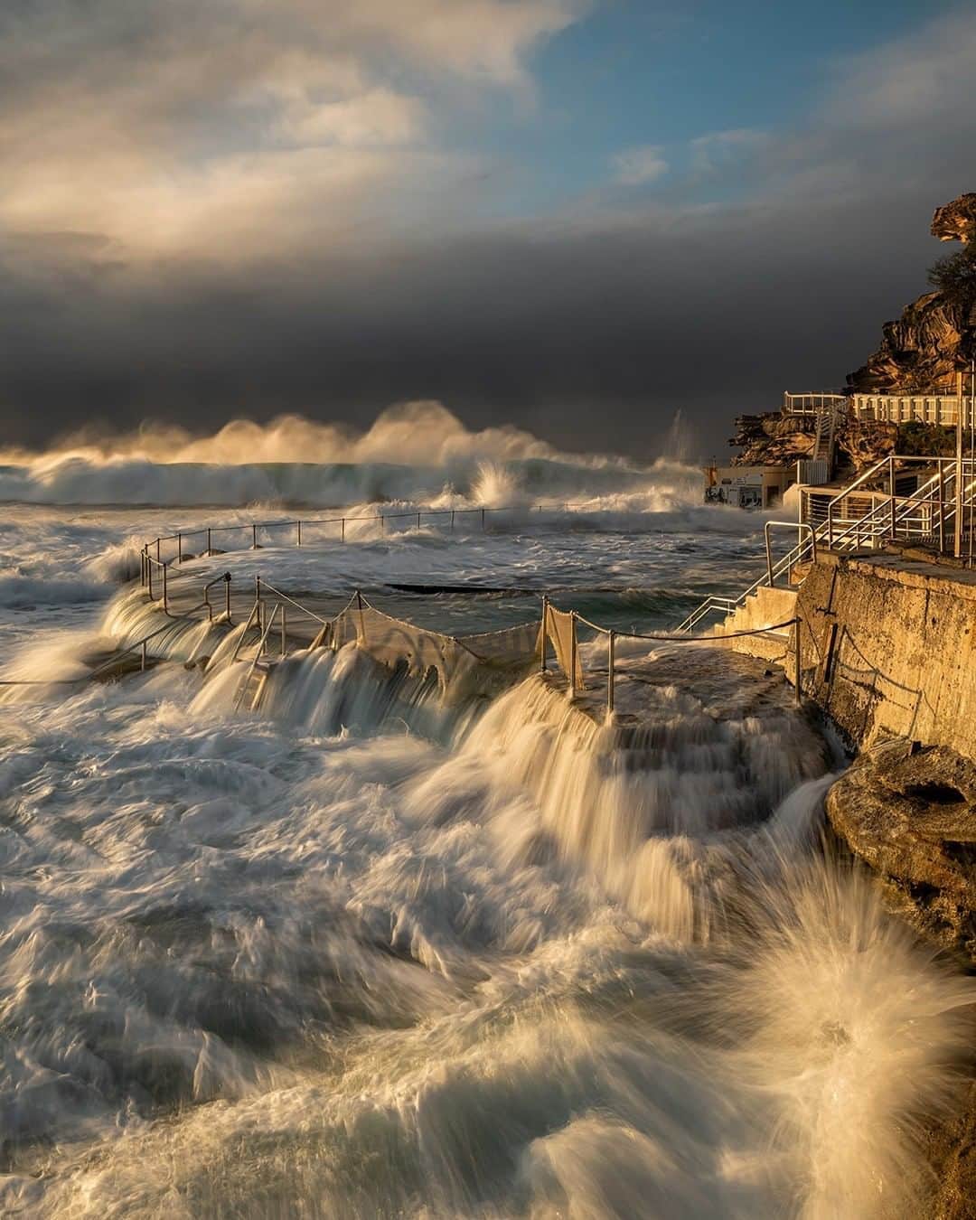 Nikon Australiaさんのインスタグラム写真 - (Nikon AustraliaInstagram)「"Bronte Pool was battered during an East Coast Low with huge waves slamming into the pool for days.  This was taken at sunrise towards the end of the storm. It was additive to try and get the right combination of waves in the background and the water flow in the foreground. In the end, I blended two images – one for the pool and the foreground and one for the wave in the background and the sky. A magic morning to be out shooting, especially when the sun broke through the clouds – it really took the scene to the next level" - @nikkibings   Camera: Nikon Z 7  Lens: NIKKOR Z 14-30mm f/4 Settings: f/8  1/30 s  ISO 100  #Nikon #MyNikonLife #NikonAustralia #NikonZ7 #Z7 #OceanPhotography」9月13日 13時00分 - nikonaustralia