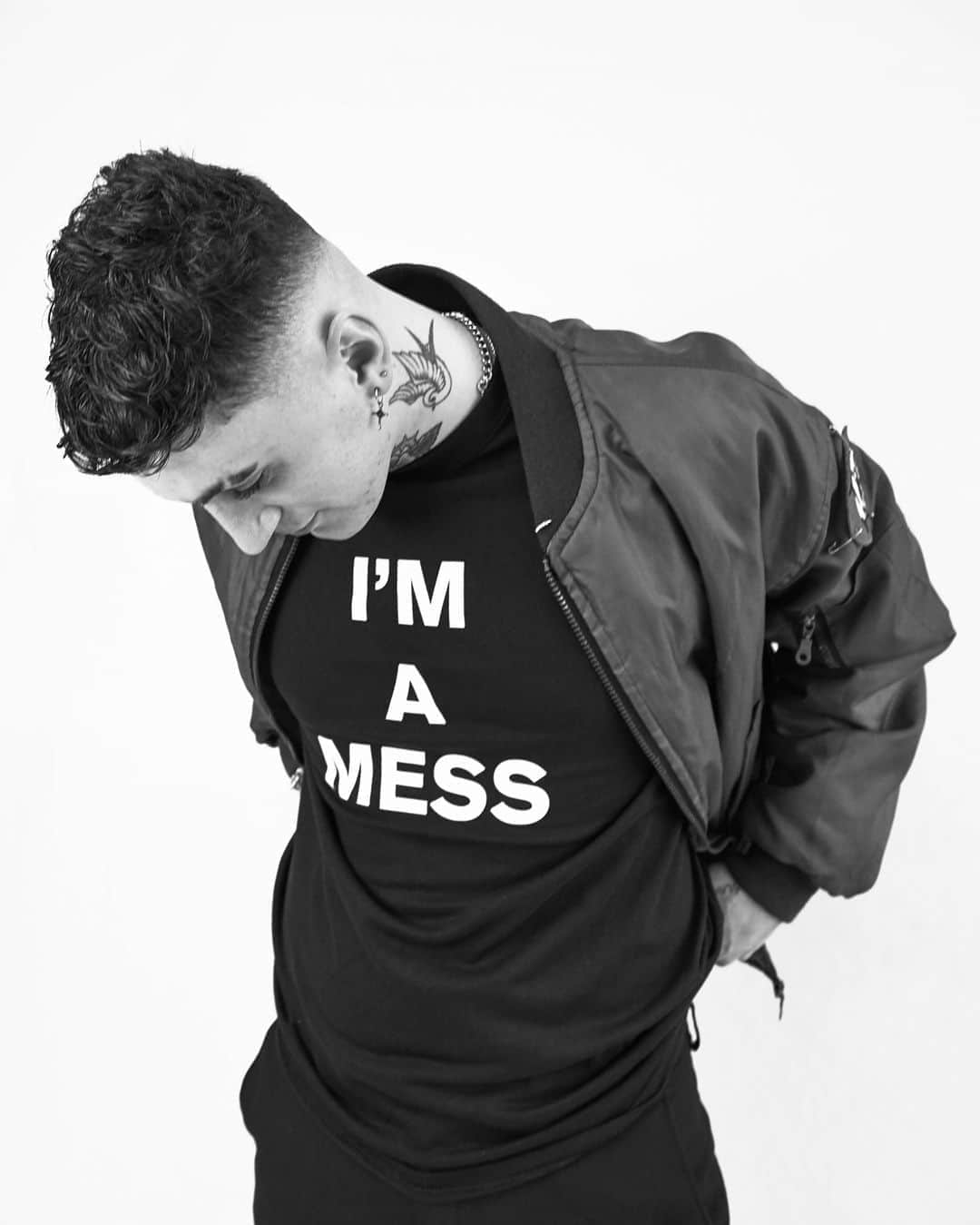 アンダーグラウンドのインスタグラム：「Jimmy wears the I'M a MESS T Shirt   I'm A Mess  I always go out drinking  On a Friday night  After a week of coming down  I'm bustin' for a fight  My brother gives me pills  And me mother gives me ice  'cause every Saturday morning  My head don't feel so nice    (Chorus)  I'm a mess  But don't tell me  I'll beat you  Don't need no friends see    My doctor says I'm down  And I need a two-week rest  So I take it down in Soho  'Cause I fight down there best  And the man from down the "dilly"  Sells me bombers and hash  And I'm always found in Wardour Street,  Where the junkies all crash    (Chorus)  Three o'clock on Friday night  A copper comes along  And after kicking me around  I started to run  But the law was all around me  So I just hit out  Now they've thrown me in the nick  Where I can scream and loon about    (Chorus)  You’re a dirty mess  I'm a dirty mess   The story starts in the Isle of Wight in 1975 with the band Stormtrooper. The members Neil Hutchings (vocals) John Pilka (Guitar), Mike Lee (drums) and Jeff Piccinini (Bass)  had put together a demo tape that was rejected by the record companies. Two years later with Punk on a role the band pulled out the track I’m a Mess. Not written as a Punk track, they were a hard rock band after all, it just seems to possess all the right ingredients needed at that time. It was noisy, and the lyrics were right on course for punkdom. In 1977 the band put together the money to self-finance the release on Solent Records with an A side “I’m a Mess” and “ Its not Me” on the B side. It sold a few thousand copies and included a pin badge “I’m a Mess “as part of the promo. The band reformed in ’78 and recorded a couple more tracks, “I’m on Fire” and “Coming my Way”. In the way that history repeats itself, they never made the cut to vinyl and the band split again. I’m On Fire ended up as a single for Chelsea after Jeff Piccinini ended up with that band. The badge?  Well that ended up on the lapel of Sid Viscous on the infamous and ill-fated ’78 tour of America. It was fitting that it was his wearing the badge that gave the track a new lease of life.  T shirt from the online store.」