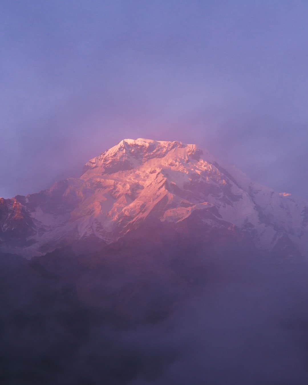 National Geographic Travelさんのインスタグラム写真 - (National Geographic TravelInstagram)「Photo by @junmichaelpark  Annapurna South in Nepal glows pink at sunset. Part of the Himalaya, the Annapurna massif stretches over 55 kilometers (34 miles) and includes 30 peaks that are taller than 6,000 meters (19,685 feet). Annapurna South is the sixth tallest peak of the massif at 7,219 meters (23,684 feet). For more photos and stories, follow @junmichaelpark.」9月15日 9時05分 - natgeotravel