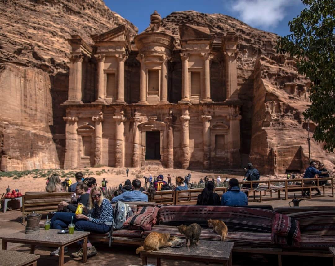 National Geographic Travelさんのインスタグラム写真 - (National Geographic TravelInstagram)「Photo by Muhammed Muheisen @mmuheisen  Tourists sit in front of Ad Deir (The Monastery), one of many facades carved into the mountains of the ancient city of Petra in Jordan. For more photos and videos from different parts of the world, follow me @mmuheisen and @mmuheisenpublic. #muhammedmuheisen #Petra #الاردن」9月15日 21時08分 - natgeotravel