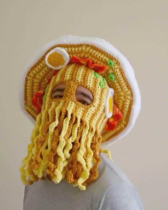 Phil Fergusonのインスタグラム：「I’m a RAMENIAC (lol)  I present to you my Orville Peck/ramen noodle crossover lol.  So this started off as an old idea that I shelved being that of a fringe noodle vest.  I think thought of what could go with it and always wanted to do some sort of @orvillepeck inspired fringe mask! After doing a heap of jumpers and the weather warming up, I’m pretty keen to go back to hats and sleeveless tops and see where I can go!  Obviously I haven’t done the vest yet, but I was loving how the hat and mask turned out that I’m pretty excited to make the rest!  Hope everyone is safe and well.  #crochet #art #fringe #noodles #craft #queerart」