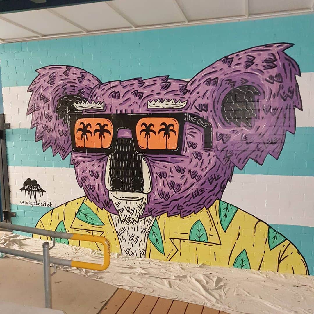 MULGAさんのインスタグラム写真 - (MULGAInstagram)「Say hello to Gregory the Koala, one of the characters in the mural I painted at a chalmers Road School In Strathfield. ⁣ ⁣ The story of Gregory the Koala⁣ ⁣ Once there was a normal greyish koala called Gregory the Koala and he wasn't purple but one day he ate some purple berries and turned a permanent shade of purple. It actually worked out pretty good for him because at the time he was the owner operator of a  paint shop that only sold paint in various shades of purple. His shop was called Gregory's Purple Paint Shop and now that his fur was purple he was super on brand and he got a bunch of publicity for his paint shop because the media interviewed him for a feel good story they could run and his paint sales went up that week by at least 13%.⁣ ⁣ The End⁣ ⁣ #mulgatheartist #koala #koalaart」9月17日 5時47分 - mulgatheartist