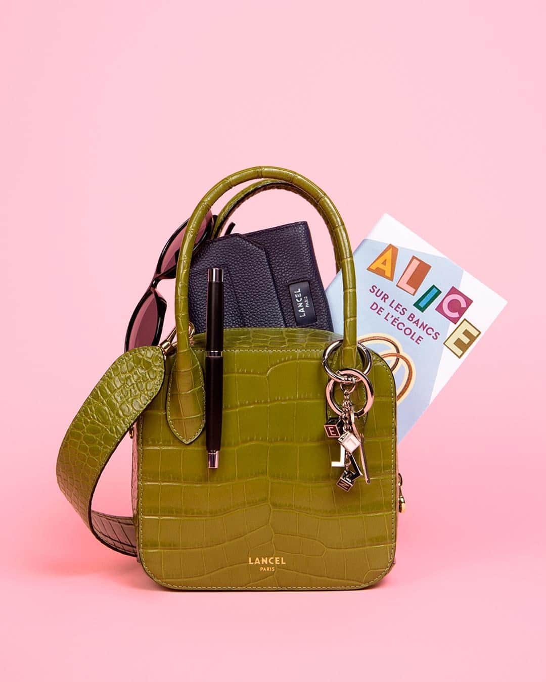 のインスタグラム：「Too cool for school Alice – Shiny croco style leather – Olive green  Révisez vos classiques Alice – Cuir façon croco brillant – Vert olive  #AliceByLancel #FW20 #Lancel」