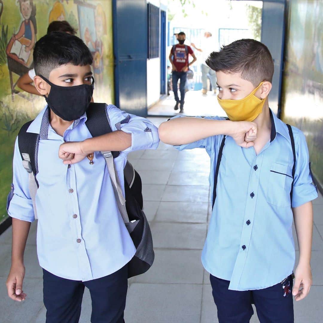 unicefさんのインスタグラム写真 - (unicefInstagram)「Yousef, a 5th grader, is excited to see his friend Husein on his first day back at school. He’s wearing his yellow face mask to protect himself. 💛  This week, nearly 49,000 Palestine refugee children in Syria were supported by @unrwa to get back in the classroom. Teachers and students are protecting themselves from #COVID19 by wearing face masks, using hand sanitizer, frequently washing their hands and respecting physical distancing. ⠀ 📷 UNRWA / Taghrid Mohammad #regram」9月17日 22時10分 - unicef