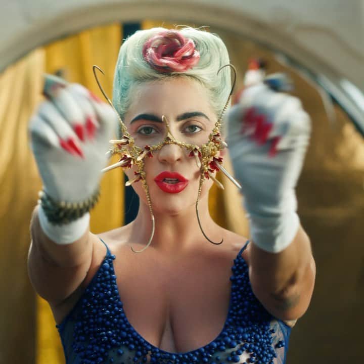 ニコラ・フォルミケッティのインスタグラム：「911 - Lady Gaga 💙 Film by Tarsem Fashion by Nicola Formichetti   LG blue oasis look -  Gold Face pieace  @lance.v.moore  Dress and skirt @diegomontoyastudio  Glove, chain, rings -stylist's archive  SAINT @Nicole_docee Outfit @richardquinn Headpiece @agnieszkaosipa  Shoes from Universal Studio Costume  UMBRELLA MAN @siazami  Shoulder piece and belt @laureldewitt  Pants @jimtannerdesigns Coat @gelarehdesigns   FIRESPIRITS  @cakeflaps  @dannyoclark  @mandellfrazier  Brock cuchna  Full orange looks @garosparo   KING @_ethancharles  Headpiece @mariannaharutunian  Eye jewellery @houseofemmanuele  Chainmail outfit @laureldewitt  Gold cuffs @gelarehdesigns  Cape from Universal Studios Costume   #chromatica  Video - LINK IN BIO」
