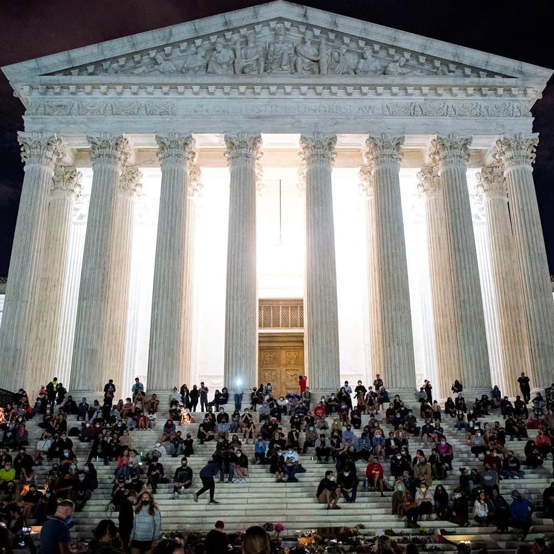 TIME Magazineさんのインスタグラム写真 - (TIME MagazineInstagram)「Candles, flowers and more outside the Supreme Court in Washington, D.C., where crowds gathered to mourn the death of Ruth Bader Ginsburg at 87 on Sept. 18. Ginsburg's early work toward greater equality was often founded on the knowledge—hard won in her own life and evident in the world around her—that the old stereotypes on which many past standards had been built no longer applied, and that life could be better once that fact was recognized, writes Lily Rothman. With that knowledge, brought to bear for her clients and later as an Associate Justice on the Supreme Court, she helped move American jurisprudence a little bit closer to what she saw as its true purpose. That purpose was something she described to @time in 1977, when she was named by the magazine as one of the nation’s top ten law professors: "To reflect and respond to the needs of the society it serves, preserving freedom while preventing turmoil." Read more at the link in bio. Photograph by Joshua Roberts (@jprpix)—@reuters and @al_drago—@reuters」9月19日 14時12分 - time