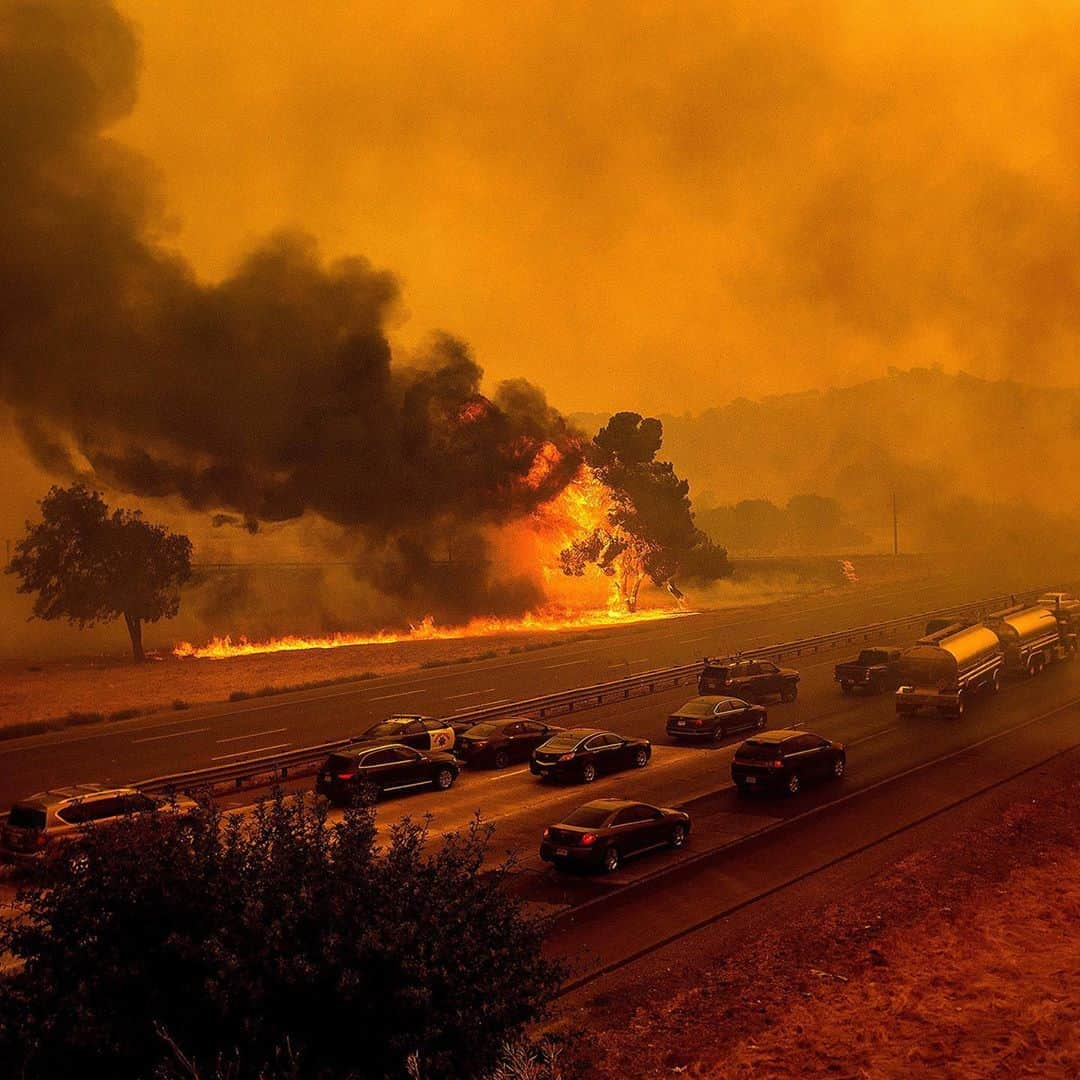 TIME Magazineさんのインスタグラム写真 - (TIME MagazineInstagram)「Imagine Massachusetts on fire, literally the entire state engulfed in flames. That is how much land has already been ravaged—at least 5 million acres—in the wildfires of California, Washington and Oregon. Put another way, in just a few weeks these fires have burned as much land as was destroyed by a decade of using napalm and Agent Orange during the Vietnam War. With temperatures over 100°F, toxic air now blankets tens of millions of people, power outages have afflicted vast regions, and dozens have already died from the blazes. Air quality in West Coast cities has ranked among the world's worst, with Portland's air at points being almost three times more unhealthy than in notoriously polluted cities like New Delhi. The scenes of red skies out of America's West have an unreal quality to them, as if they come from a different planet. In a sense they do—they are portents of the future, writes @fareedzakaria. Read the full essay, adapted from Zakaria's new book Ten Lessons for a Post-Pandemic World (Oct. 6), at the link in bio. In these photographs: Flames from the LNU Lightning Complex fires along Interstate 80 in Vacaville, Calif., on Aug. 19; homes leveled by the Almeda Fire line at Bear Lake Estates in Phoenix, Ore., on Sept. 15. Photographs by Noah Berger (@noah3929)—@apnews」9月21日 2時26分 - time