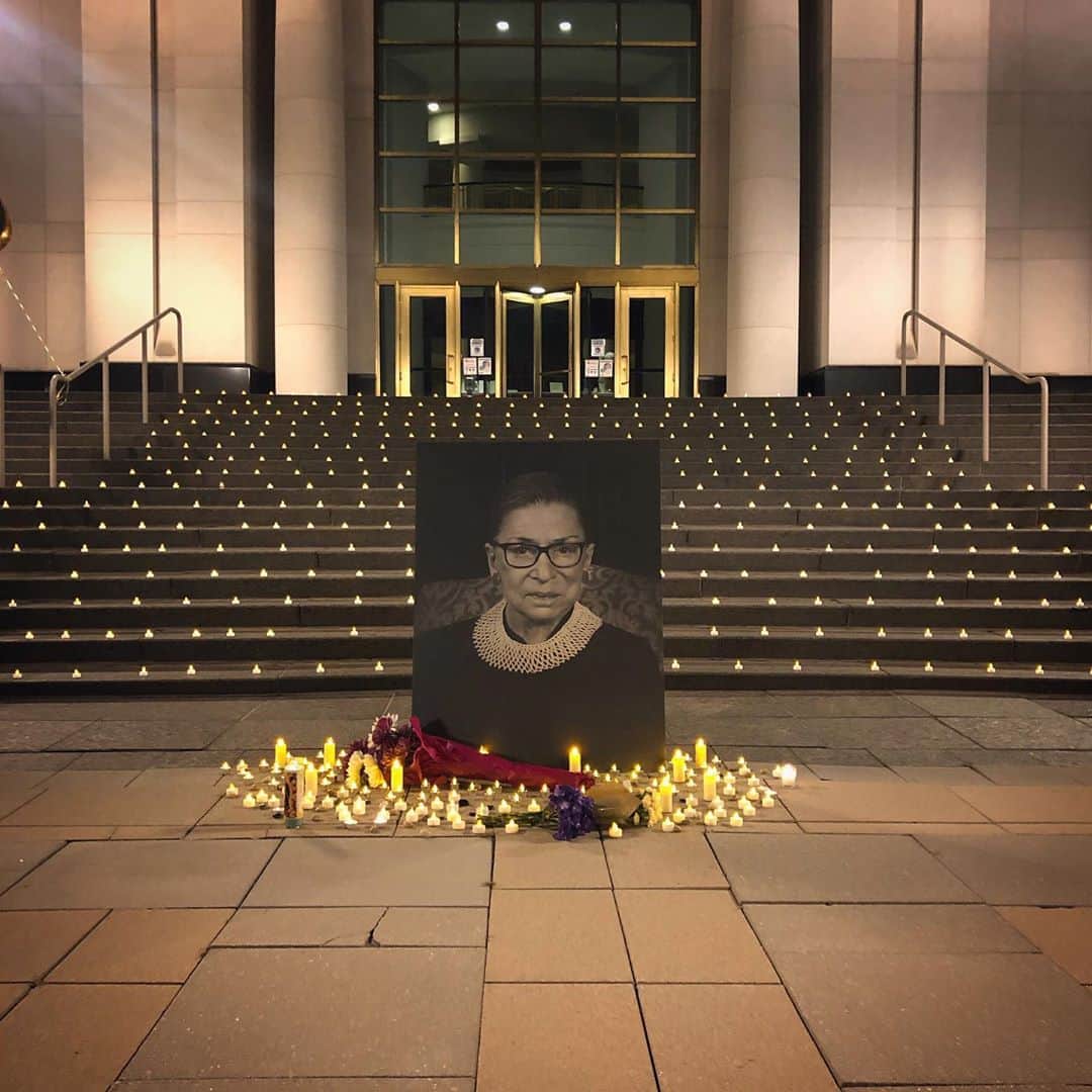National Geographic Creativeさんのインスタグラム写真 - (National Geographic CreativeInstagram)「Photo by @andreabruce  At 8 pm on Saturday, September 19, 2020, courthouses across the United States held vigils in honor of the late Justice Ruth Bader Ginsberg. Here, at the Michigan Hall of Justice in Lansing, MI, mourners lit candles and placed rocks in front of her image. Around 80 people attended for an hour of somber silence. Many of the attendees came alone. Several wept. The vigil was held by the local Planned Parenthood」9月21日 12時31分 - natgeointhefield