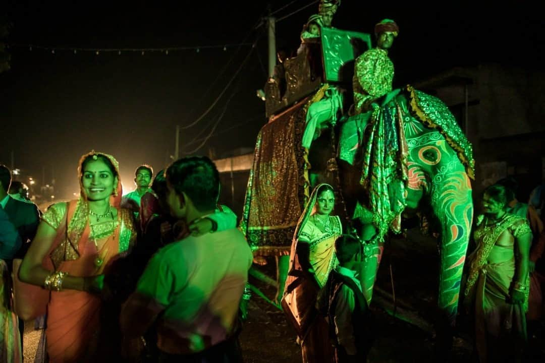 ナショナルジオグラフィックさんのインスタグラム写真 - (ナショナルジオグラフィックInstagram)「Photo by @johnstanmeyer / A groom is carried to his wedding reception on an elephant draped in colorful fabrics and surrounded by dancing celebrants in Singhana, Rajasthan. Often elaborate affairs, thousands of marriage ceremonies take place across northern India during the wedding season, from September to February. Wedding dates and times in Hindu communities are suggested by astrologers. The image is from my latest story in @natgeo magazine, "Water Everywhere, and Nowhere," in the August issue, now on newsstands worldwide. @outofedenwalk #walkingindia #edenwalk #india #rajasthan #wedding  Check out Nat Geo's link in bio for more on this story.」10月6日 15時39分 - natgeo