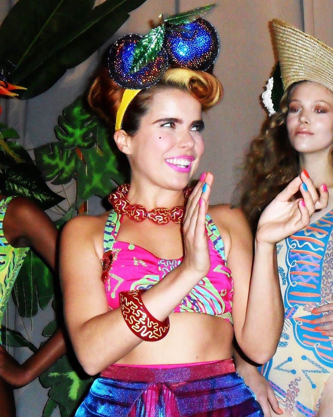 のインスタグラム：「🌈 As we say adieu to summer here’s a colourful #tb of @palomafaith in our @swarovski encrusted hyper-cherries to lighten spirits 😍. Worn for SS12’s presentation... 🌺🌴💙💖  Ft. Bathing costumes and sarong by @zandra_rhodes_   #piersatkinson #palomafaith #zandrarhodes #🌈 #millinery #hat #hats #headpiece #headdress #headband #milliner #maker #whowantstobeamilliner?!⁠」