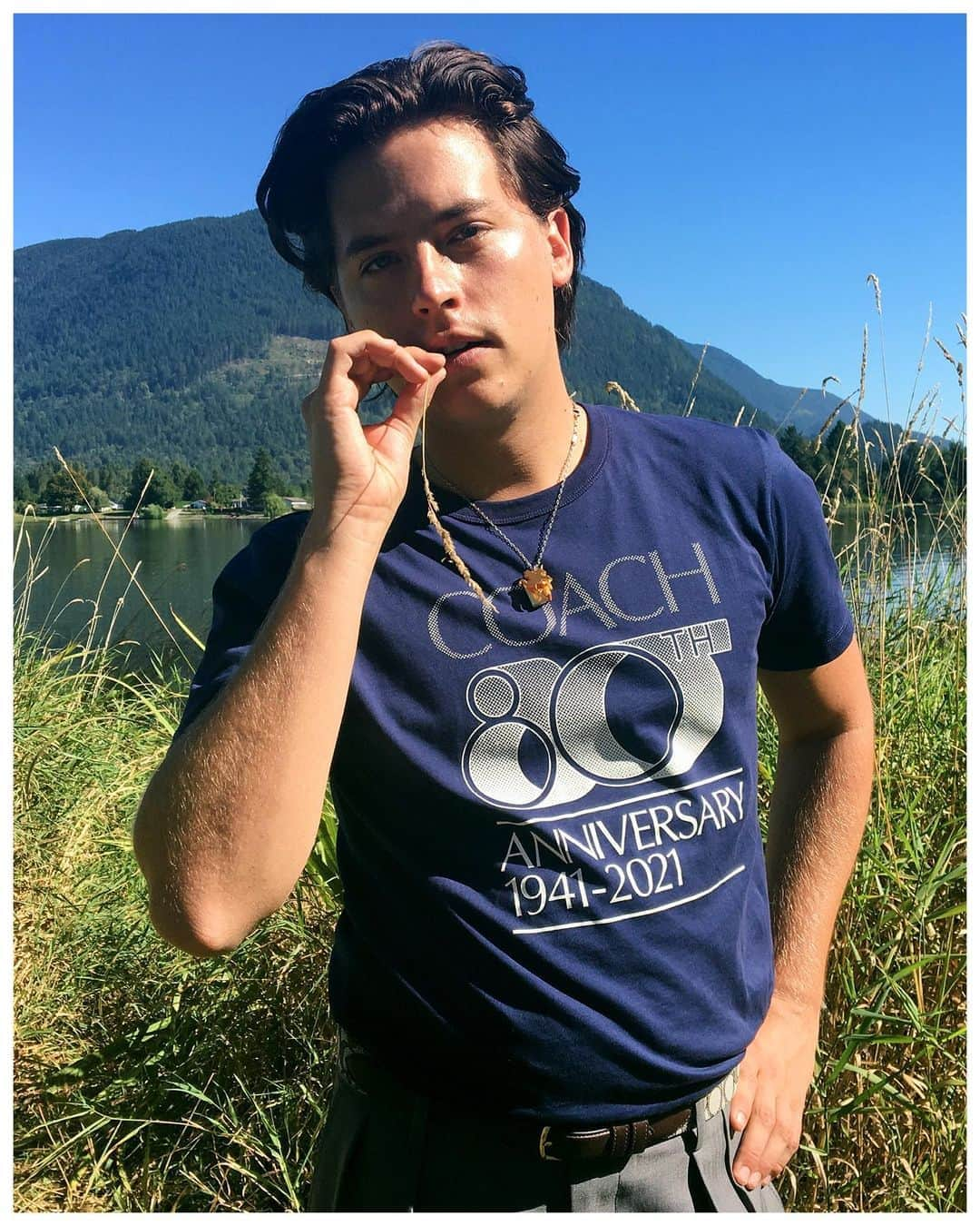 コーチさんのインスタグラム写真 - (コーチInstagram)「By a lake in Vancouver, British Columbia, #ColeSprouse continues the #CoachForever story, handpicking a little 🌾 just for you. . . Cole wears a Spring 2021 T-shirt that celebrates 80 years of Coach: the original American house of leather since 1941. . . #CoachForever is our Spring 2021 collection, presented in collaboration with #JuergenTeller and the #CoachFamily. Crafted to last, it features new, vintage and archival styles.   Photographer: #JuergenTeller Creative Partner to Juergen Teller: #DovileDrizyte Stylist: #OlivierRizzo With thanks to #AshleyBrokaw, #GuidoPalau and #PatMcGrath. #CoachNY」9月23日 0時55分 - coach