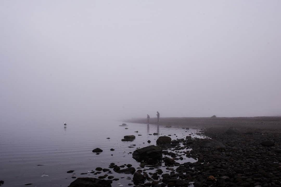 National Geographic Travelさんのインスタグラム写真 - (National Geographic TravelInstagram)「Photo by Luján Agusti @lujanag / Two people walk along the foggy coast of Ushuaia, Argentina. From time to time the mist reaches the city and you can barely see from a few meters away. The feeling is very magical, like floating in the middle of nowhere. A few months ago when it happened, I went out with my camera to register that magical moment. I met this father and his son exploring the coast.  This image is part of the documentary piece "The new end of the world" that I made in collaboration with Nico Deluca for the @covid19visualproject for the Cortona On the Move Festival. Follow me @lujanag to learn more about my life and work in the southern island of Tierra del Fuego.」9月24日 9時04分 - natgeotravel