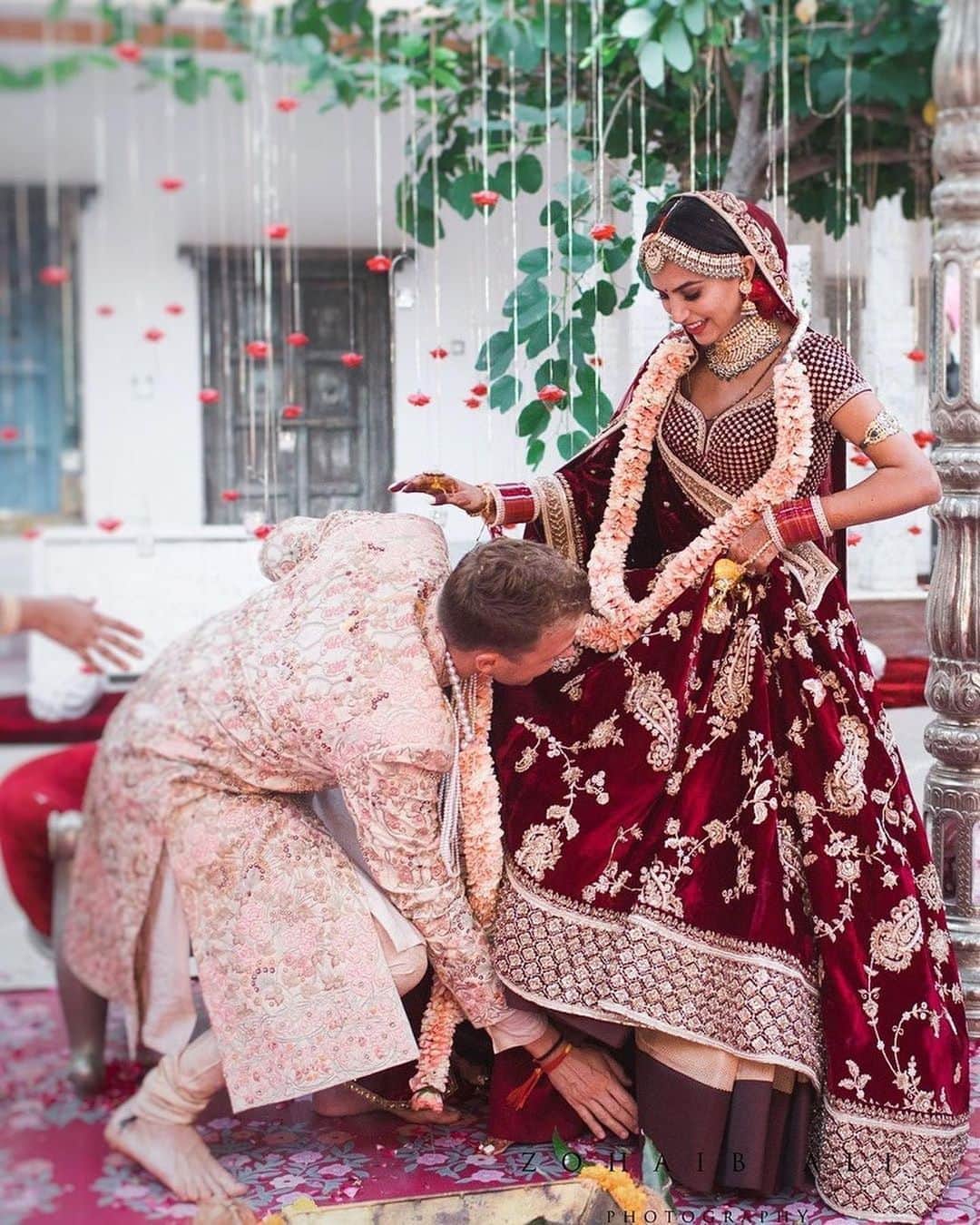 Diipa Büller-Khoslaのインスタグラム：「Happy 2nd Wedding Anniversary my @olegbuller ❤️ - Repost @officialhumansofbombay We met at university in Amsterdam. It was my first day & I was a bit lost. Oleg was the first person I met–he was the student body president. When we spoke, I felt a spark–but all the while I was thinking, ‘Shit, I’m in a hoodie!’ We only got 6 months together at Uni, since he was in his final year. We only met in the dining hall or on campus. There was this flirtatiousness, but we didn’t act on it. After he left, we only wished each other on birthdays. Then 5 years later, he replied to my birthday wish & said, ‘If you’re ever in Amsterdam, let’s get a meal.’ I was in London & didn’t say ‘yes’ immediately. He was a ‘bad boy’ in Uni, so I made him wait for 6 months after which we met for dinner.  And as soon as I saw him, the butterflies came rushing back. It was a perfect night–we just connected. He even remembered what I was wearing that first day on campus, despite meeting over 2000 students! I knew he was the one.  I returned to London & we’d meet every 2-3 weeks. We’d constantly be on the phone or watch movies–the distance made our time together special. I still remember our first kiss–we were at the station when he pulled me towards him & kissed me. That year on NYE, at 12, he said, ‘I’m going to ask you to marry me this year.’ I thought he was drunk; especially since he didn’t bring it up again! But we knew this was it & decided to move in. On our first day at home, I remember Oleg smiling when I was making coffee. A few months later, I got a dinner invitation from Vogue in a palace at Udaipur, but Oleg had to cancel because of work. So I went alone–on the day of the dinner, I went to the courtyard to find Oleg down on one knee, asking me to marry him. I was like, ‘How are you in India!’ Amidst all the shock, I said ‘yes’! Our wedding was a perfect mix of European & Indian culture! I remember, a few months before, my mom ran us through all the ceremonies of an Indian wedding. When the part of the woman touching the man’s feet came up, our response was, ‘Why just the woman?’ So at the wedding, Oleg touched my feet & I, his. We even adopted each other’s surnames.」