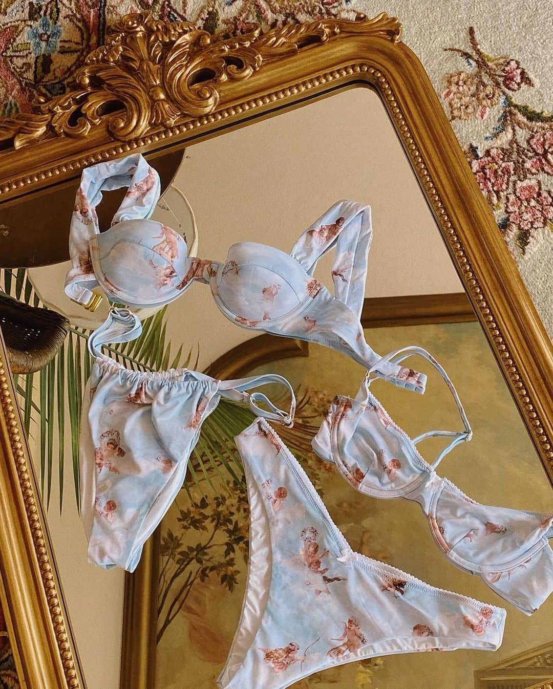 We Wore Whatさんのインスタグラム写真 - (We Wore WhatInstagram)「The Boudoir Collection ☁️  ⁣ Swimwear and coverups inspired by the intimate moments in a women’s private dressing room and delicate vintage lingerie. Sexy, feminine, and soft. ⁣ ⁣ Our toile print was hand drawn by our in house print designer and is inspired by Danielle’s childhood bedroom wallpaper. ⁣ ⁣ The baby angel print in this collection creatively reinterprets the iconic cherubs of Francois Boucher [Rococo painter 1700s]」9月24日 23時13分 - weworewhat
