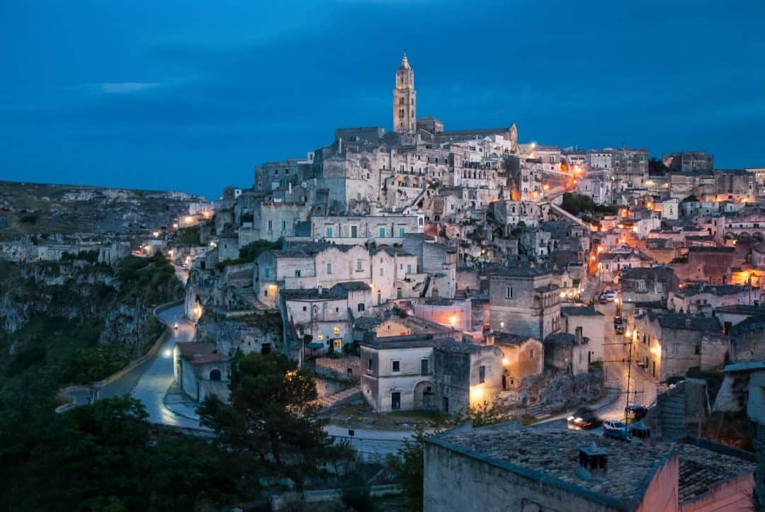 National Geographic Travelさんのインスタグラム写真 - (National Geographic TravelInstagram)「Photo by @francescolastrucci / A view of the Sassi at night in Matera, Italy. At Matera’s core are hundreds of caves once used as dwellings. The Sassi, now on the UNESCO World Heritage List, hold evidence of human settlements from the Paleolithic period to the present day. After a period of decline adventurous artists began moving back, and the recent history of the Sassi is precisely that of an awakening. Caves were restored and turned into more comfortable houses, unique hotels, restaurants, and galleries. Matera came back to life to the point that it was awarded the title of European Capital of Culture in 2019.  Follow me @francescolastrucci for more places, daily life, and stories around the world. #matera #italy #dailylife」9月25日 1時06分 - natgeotravel