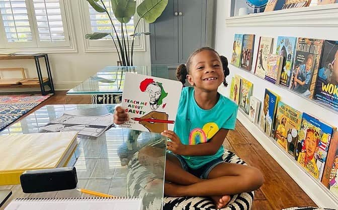 ロックモンド・ダンバーのインスタグラム：「Posted @withregram • @mrs_maya_dunbar We've started our journey of learning/appreciating who Marcus Mosiah Garvey was and what he stood for. @jameswrites615 book Teach Me About Garvey makes me cry EVERY. SINGLE. TIME. It's poetic and simple in its presentation which allows easy digestion for younger kids yet still so immensely powerful & moving. Thank you brother James, our elder Marcus is shining his light down on you!! Berkeley is loving cursive writing and determined to master this lost writing technique. Which I'm grateful for because I too love to write in cursive. It can be so beautiful. Thanks to @blossomandroot for our 'we come from stardust' nature project which saw us create a nature mobile to help understand the cosmos and the role the sun along with the planets our solar system. And of course, a big shoutout to @singaporemath for the fun & challenging dimensions 1st grade math. I'll say this as we approach the end of our 2nd month of homeschooling---every bump in the road along the way is 100%%%% worth it when I see/hear Berkeley apply the concepts/history etc she's learning in every day life. To watch her mind, knowledge and capacity for learning expand right before my eyes has been a treasure to see. That's not to say we don't bump heads at times, or there aren't struggles in this process but I'd rather deal with those than what is created when a black child is indoctrinated their entire life by a white supremacist educational system. You may be successful, even wealthy...but the mental shackles placed on the mind do irreparable damage to the psyche and soul. Never permitting the black adult to fully embrace, nor understand our history, culture, nor our fully realized greatness. Therefore incapable of fully grasping the systems in place created to intentionally keep us in 'our place.' Imagine celebrating your ancestors oppressors: religion, holidays, culture and history while turning your nose down at your own! This will be the greatest gift I can leave these children with. A 150%%% FREE MIND! #blackhomeschoolers #blackhomeschooling #blackhomeschool365 #blackhistoryisamericanhistory #blackhistory365 #education #homeschool #marcusgarvey #amoswilson」