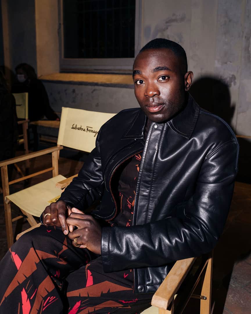 のインスタグラム：「The Salvatore Ferragamo Spring/Summer 2021 fashion show opened with a short film by director Luca Guadagnino, linking to the world of cinema that was well represented by celebrity guests such as English actor Paapa Essiedu, captured here in a bonded leather jacket and brinjal palm print ensemble. #FerragamoSS21」
