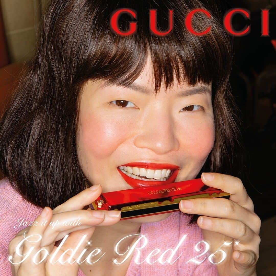 のインスタグラム：「Matching unexpected objects, @guccibeauty’s #GoldieRed25 lipstick shade appears in a series of playful images. Seen here is the long-lasting satin formula. Discover more through link in bio. #GucciBeauty  #AlessandroMichele @alessandro_michele」