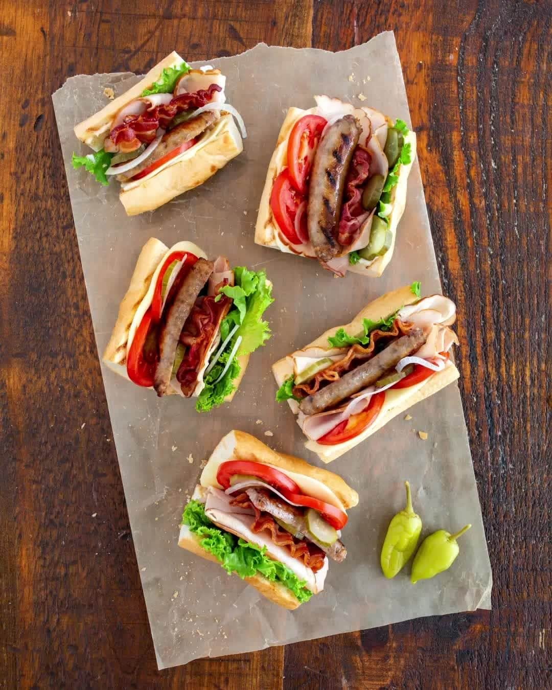 ジョンソンヴィルのインスタグラム：「How about a little meat with your meat? These #Oktoberfest Sausage Hoagies are a meat lovers dream: brats + ham + turkey + bacon... did we mention there's meat? #LinkInBio for the recipe details on this savory sandwich!」