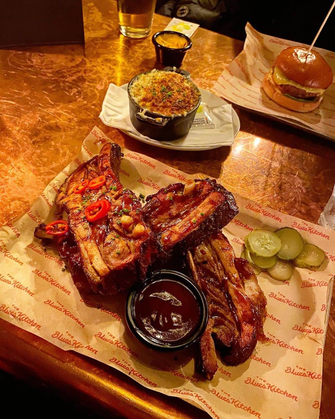 Eat With Steph & Coのインスタグラム：「£10 ribs £10 ribs! This stack is only £10 on Mondays @theblueskitchen . unbelievable value! I took some home for lunch 😂 other menu highlights are the Mac and cheese (did you even go to Blue Kitchen if you didn’t get this!?) and the burger spring rolls 🤤  Price: £10-£15 for a main Cuisine: American soul food  Best for: dinner and drinks with your mates (happy hour on Thursday and Friday 👍🏻)  Top dish: £10 Monday ribs  Book ahead: Yes  Vegans/Veggie options: Yes good range   #blueskitchen #americansoul #ribs」