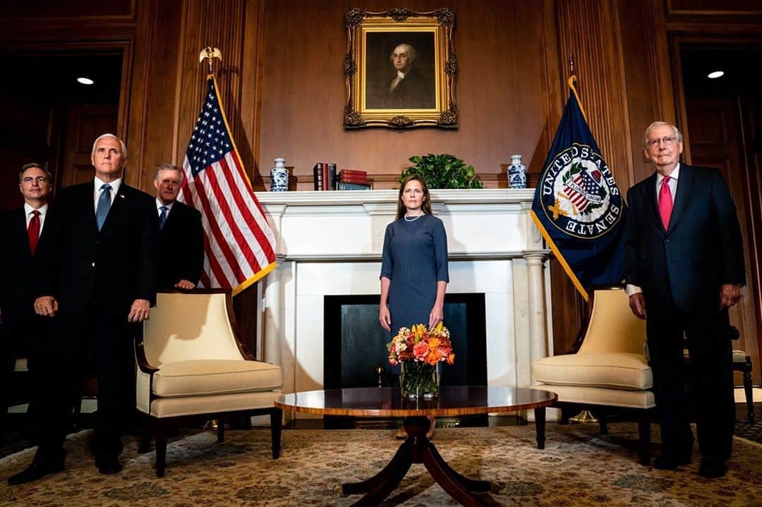 TIME Magazineさんのインスタグラム写真 - (TIME MagazineInstagram)「Judge Amy Coney Barrett meets with Vice President Mike Pence, left, and Senate Majority Leader Mitch McConnell, right, during a series of meetings in preparation for her upcoming confirmation hearing, at the U.S. Capitol in Washington, D.C., on Sept. 29. The death of Justice Ruth Bader Ginsburg and President Trump's quick nomination of Barrett has escalated an already-tense political environment in the U.S., shaking up the presidential campaign and animating activists across the political spectrum. A remade Supreme Court populated by Trump appointees threatens to overturn abortion rights, roll back voter protections and scrap the Affordable Care Act. The future of the Court will also shape the future of U.S. climate policy, writes Justin Worland. A Supreme Court remade in the vision of the right could take aim at existing climate change measures—and the legal justifications underpinning them—while also impeding the ability of federal government agencies to implement new ones. Read more at the link in bio. Photograph by @erinschaff—@nytimes/Pool/Bloomberg/@gettyimages」9月30日 1時45分 - time