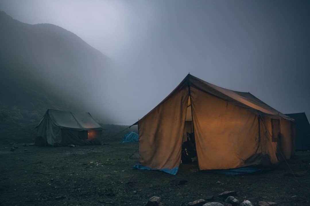 National Geographic Travelさんのインスタグラム写真 - (National Geographic TravelInstagram)「Photo by @joshuacogan / Mist rolls into our evening’s mountain camp as we make the pilgrimage from Paro to Thimphu. In these areas of the Himalayan high meadows, the land is quite marshlike from steady precipitation during the summer months. A cup of tea and a fire kept us warm through the near-freezing night until it was time to hike again early the following day.  For more images of pilgrimages throughout the world, follow me @joshuacogan. #Bhutan」10月1日 17時09分 - natgeotravel
