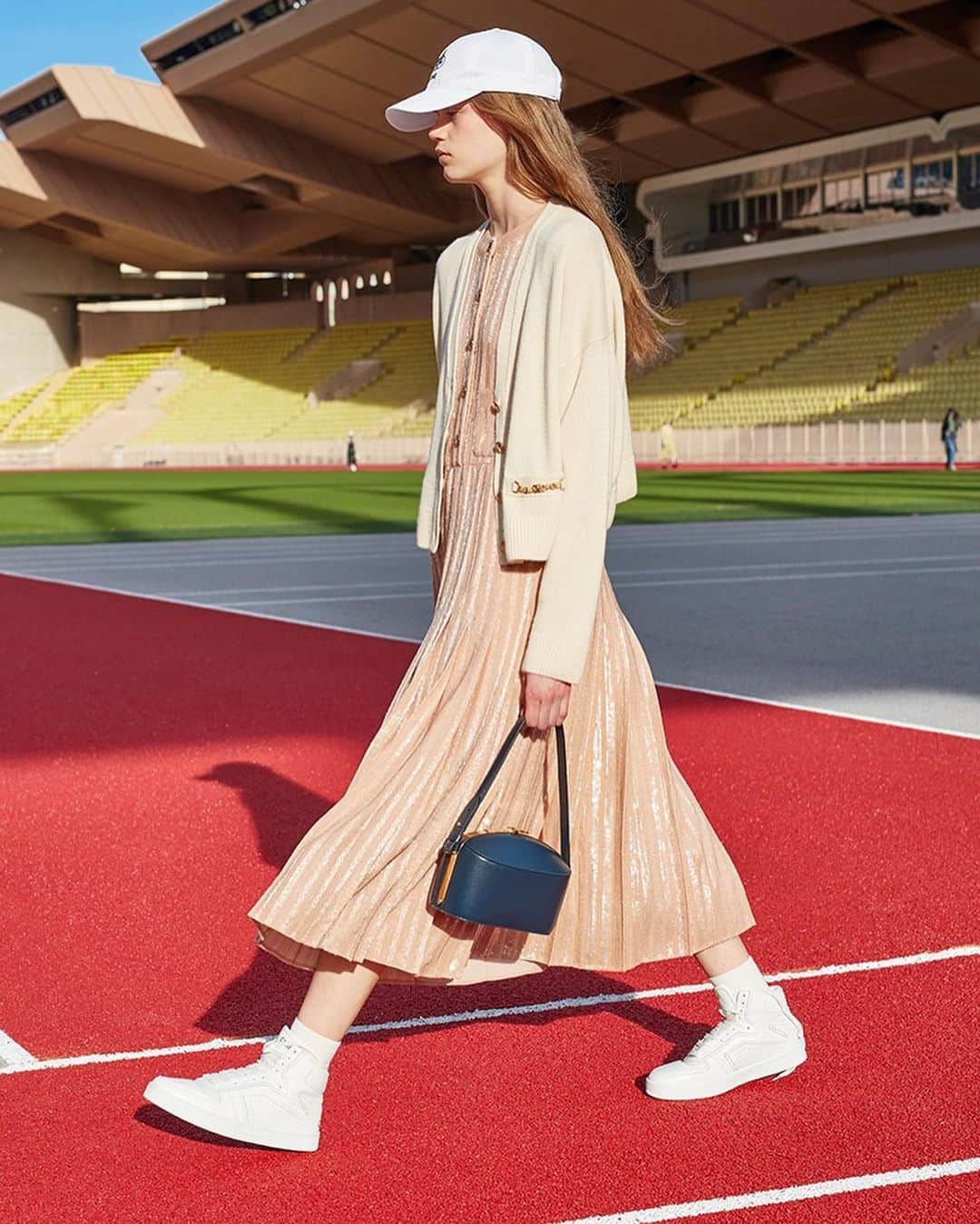 Vogue Parisさんのインスタグラム写真 - (Vogue ParisInstagram)「A new @celine woman walked the runway today in Monaco behind the closed doors of the open air Louis II stadium. The signature Parisian elegance was given an air of nonchalance and a sportswear edge this season for an athletic couture wardrobe: hoodies and tracksuits were printed with links while dresses (which were longer than usual) were worn with white sneakers, and Nineties-style jeans were paired with silk draped crop tops and caps. It was a statement of adolescent chic summed up in the press release as ‘20 in 2020’. #celine」10月27日 6時16分 - voguefrance