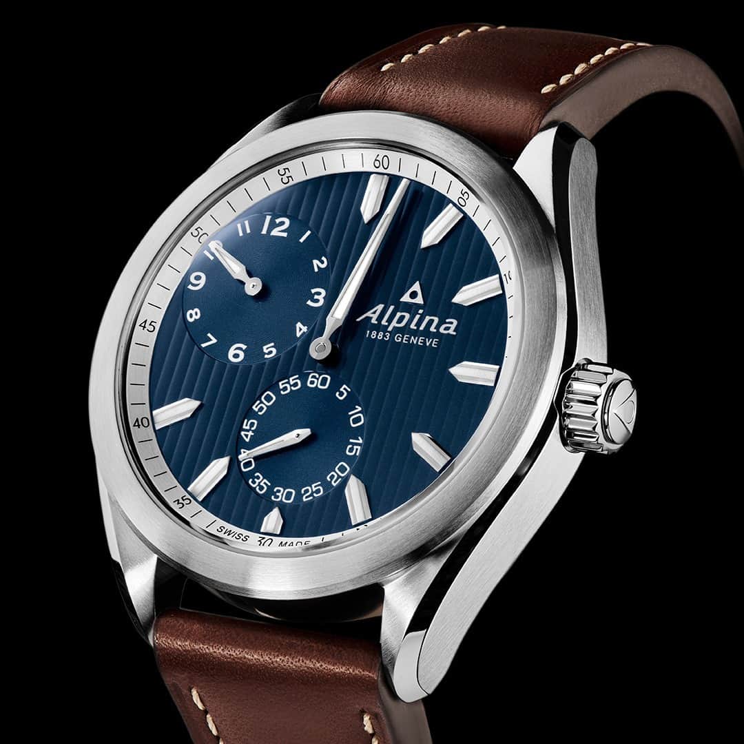 のインスタグラム：「The #AlpinerRegulatorAutomatic collection's aesthetic signature is the dial, entirely decorated with Côtes de Genève, traditionnaly used to reduce reflections and avoid dazzling the watchmaker at work.  #AlpinaWatches #ReachYourSummit  Check out our link in bio to learn more about our Alpiner Regulator Automatic.」