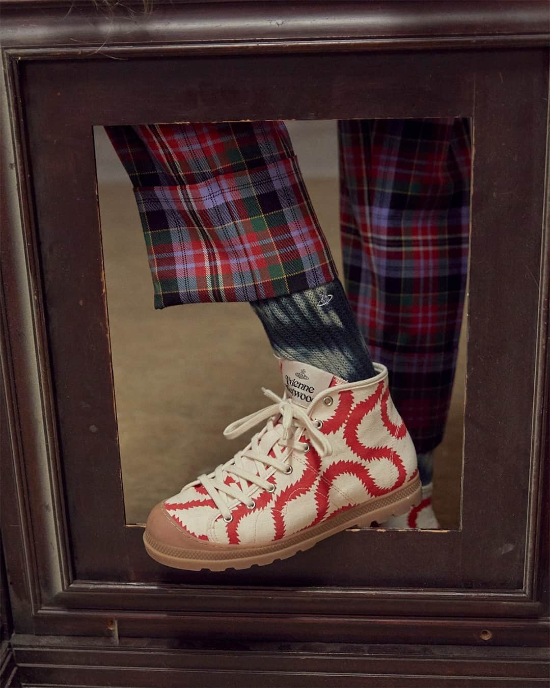 のインスタグラム：「Crafted from 100% cotton canvas and decorated in our iconic Squiggle pattern all over. The Simian Boots are 100% plastic free, set on thick rubber soles made with 40% recycled rubber, coloured in beige and red hues, and feature a lace-up finish. No leather or products derived from animals were used in the production of these shoes. #VWAW20」