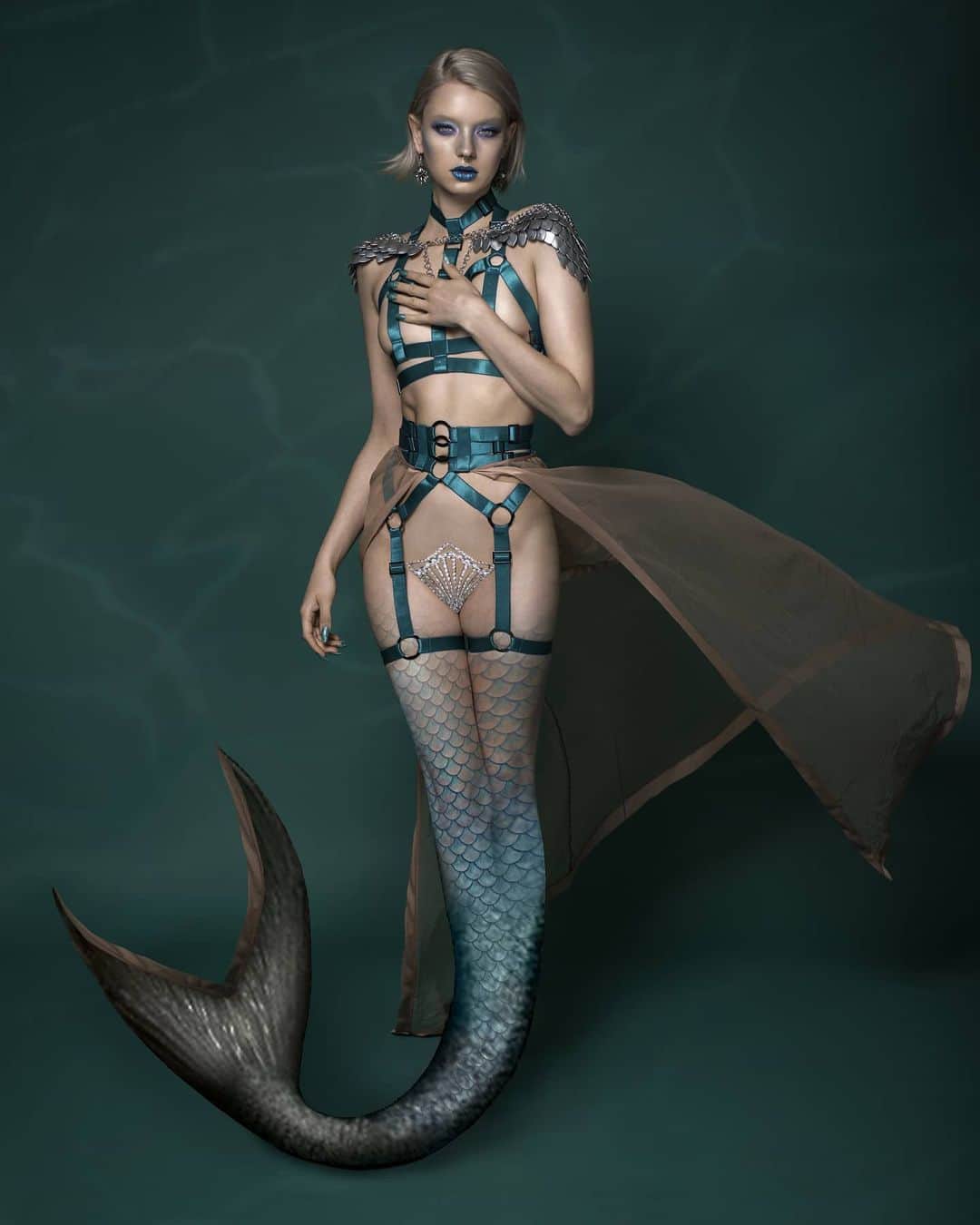 ティール・ココのインスタグラム：「Mermaid's are real...fyi! 🧜🏼‍♀️💙 Currently wishing I could swim off into the sea and start a new existance! How you doing? . . . Wearing: @tealecocothelabel ✳️ Photography+editing: @shotography 📸 Styling: @mylingerieaddiction 👗 @makeupby__mary 💄」