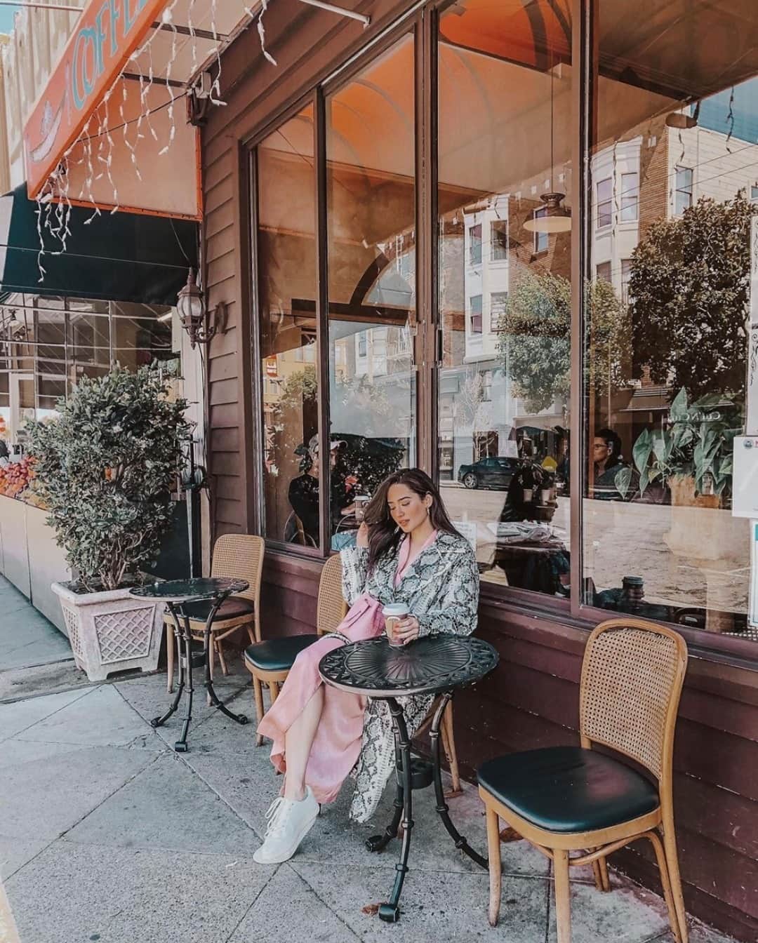 ケネスコールのインスタグラム：「Kam and coffee...@nicole_andersson steals a moment of peace in our iconic Kam sneakers. #FuelYourself #VoteToExist #FallStyle  When you shop at KennethCole.com, we’ll donate to The New York Public Library in support of The Harry Belafonte Black Liberation Speaker Series. Info link in bio.」