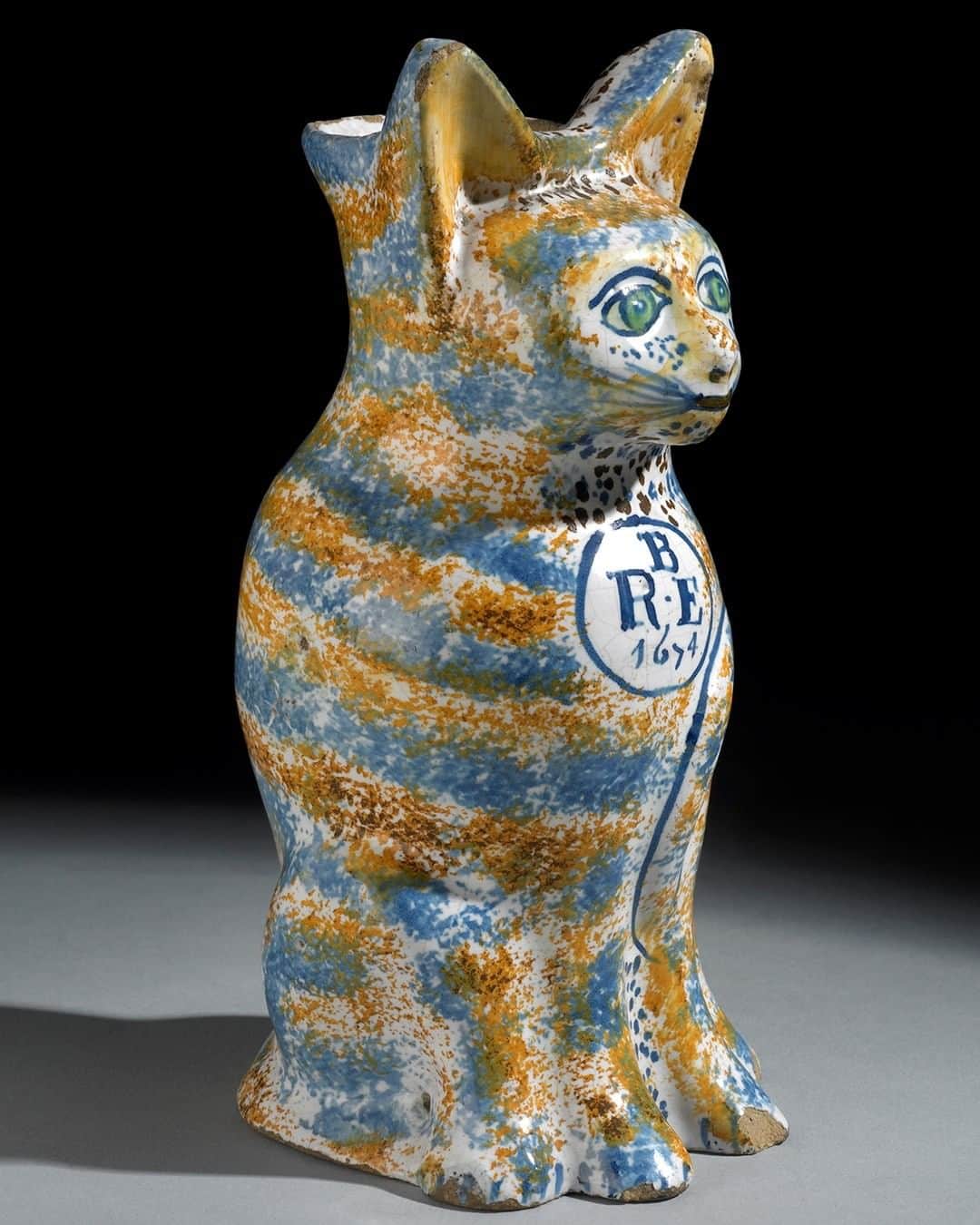 大英博物館さんのインスタグラム写真 - (大英博物館Instagram)「🐈 Meow!  This colourful tabby cat jug was probably made as a wedding gift in 1674. The initials R E B are thought to commemorate the marriage of Richard Beazer and Elizabeth Hancock, who married at Whitechapel in London on 8 December of that year.   🔎 A tin-glazed earthenware, moulded in the form of a seated cat. Southwark, south London, 1674.   #CatsOfInstagram #cats #BritishMuseum #NationalCatDay」10月30日 2時00分 - britishmuseum