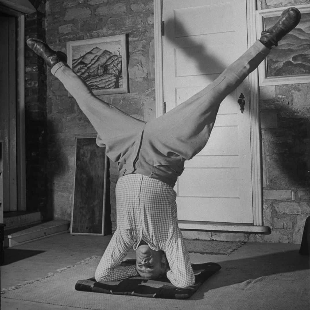 lifeのインスタグラム：「Musician John Jacob Niles practicing yoga to "relax after folk singing," Kentucky, 1942.  LIFE began covering yoga in the United States in 1937, noting that a practitioner could "join himself with a higher world-soul." To see some of our favorite yoga photos from the archives — including shots of Ricky Soma (Angelica Huston's mother), the artists of Big Sur, and Eva Longoria — check out the link in bio. #tbt #yoga #johnjacobniles  #evalongoria #yogaposes」