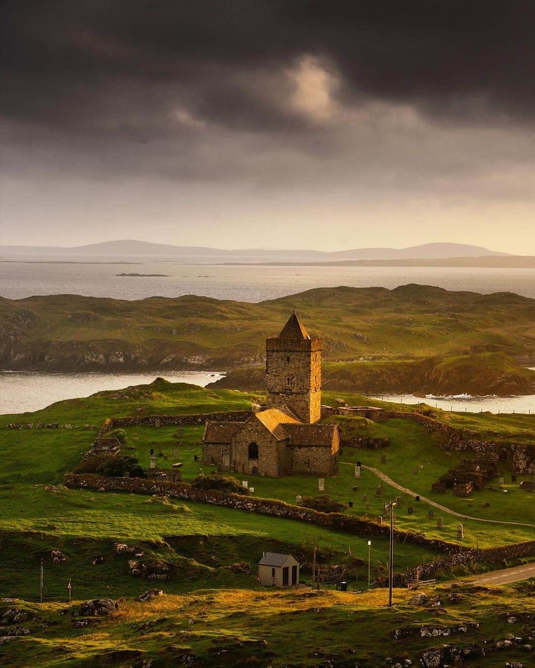 National Geographic Travelさんのインスタグラム写真 - (National Geographic TravelInstagram)「Photo by @jimrichardsonng / A glowing sunset lit up St. Clement's Church at Rodel on the Isle of Harris. Looking south the islands of Berneray and North Uist layered the hazy horizon of complex lands we mistake for being simple. The church was Catholic when built in 1520, but the Reformation ended that by 1560. The MacLeods of Dunvegan favored the place; the graveyard is full of them.  For more from Scotland, follow me @JimRichardsonNG.  #scotland #hebrides」10月7日 5時17分 - natgeotravel
