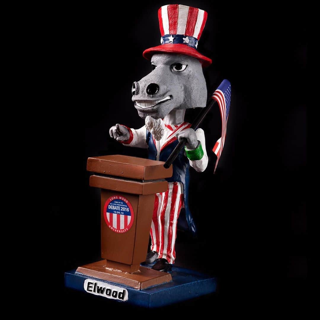 のインスタグラム：「Why do colleges host presidential debates? Because it’s a great opportunity for a bobble head with the campus mascot? Yes—but that’s not the *only* reason. . .The College of William and Mary was the first campus to host a presidential debate (1976); many observers at that time thought colleges and universities should become the standard sites for presidential and vice presidential debates. However, this didn’t become the norm until the Commission on Presidential Debates became the chief sponsor. Since 1988, all but four debates have been held on a campus.   The primary reason to choose school locations is the overlap between the educational mission of colleges and universities and the Commission’s mission to educate voters. In addition, there are financial motivations on both sides. Colleges and universities often have the ability to cover the costs of holding a debate, typically more than $4 million. But there has frequently been a good return on this investment. Centre College has hosted two vice presidential debates; they estimate the debates increased their student body 10% and provided $53 million in publicity for the school. John Roush, Centre’s president, observed that debates bring “civic excitement as well as a modest economic boost” to host communities.   Finally, colleges and universities appreciate the opportunity debates provide to improve their visibility. To enhance this, they produce debate souvenirs. Longwood University presented their mascot Elwood as a bobble head debater and issued a scarf to commemorate the 2016 vice presidential debate (scarves are a Longwood campus tradition). Other campuses have made buttons, key chains, pompoms, and fans. All these efforts pay off. UNLV reported an 87% increase in views to their admissions page after their debate. William and Mary and the University of Richmond believe their debates raised their institutions to national prominence and Longwood University credits their experience with shining “an international spotlight” on their campus.   Will you be “going to class” with the candidates tomorrow?   #AmericanHistory #VoteHistory #CampaignHistory #PresidentialHistory #AmericanDemocracy」