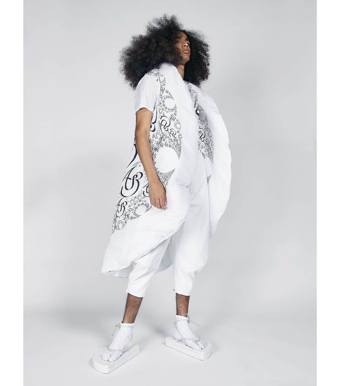スリーアズフォーのインスタグラム：「Our New collection “Vesica Piscis” is out on @voguerunway  Photographer : Elisabet Davids @elisabet_davidsdottir @elisabetd  Model: Joseph Gelpi @chicojoseph at Ford Models  @fordmodels  Stylist : Victoria Bartlett @victoria_bartlett_nyc  Hair: Kenta Koda @kenta.koda  Makeup: Chichi Saito @chichisaito  Prints in collaboration with Mimaki  @mimakiusa @mimakiusa_textile @threeasfour #threeasfour #vesicapiscis」