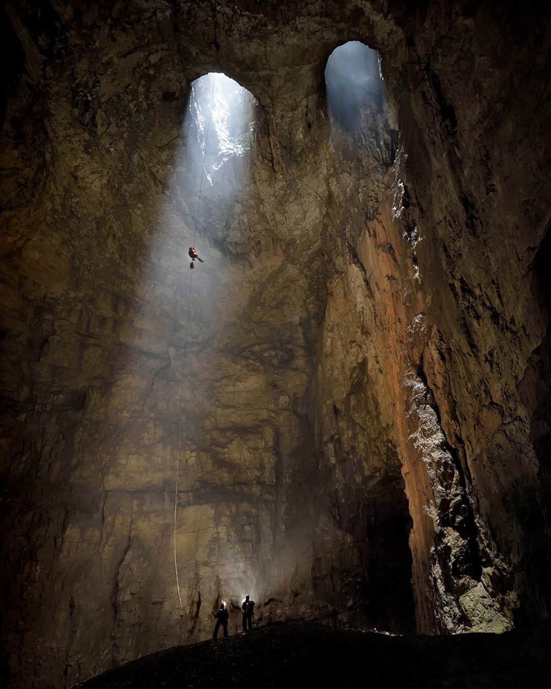 ナショナルジオグラフィックさんのインスタグラム写真 - (ナショナルジオグラフィックInstagram)「Photo by Robbie Shone @shonephoto / Kačna jama (cave) is 280 meters (over 900 feet) deep, the third longest cave in Slovenia. The iconic twin skylight portals allow cave explorers access inside, where the Reka River can be seen flowing steadily toward the coast.」10月7日 11時34分 - natgeo
