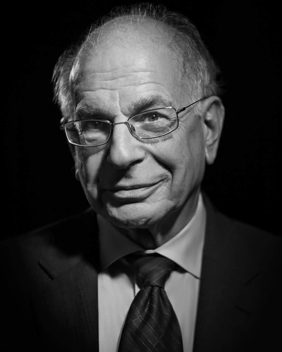 ZOO Magazineさんのインスタグラム写真 - (ZOO MagazineInstagram)「ISSUE 68, MOTUS  Nobel laureate Prof. Daniel Kahneman – Professor Emeritus of Psychology and Public Affairs at Princeton University – is a towering figure in psychology, and cognitive psychology in particular. Over the years, Prof. Kahneman has reserved extensive attention to research on the complex definition of well-being and happiness, distinguishing two very different notions of selves: an experiencing self, and a remembering, evaluating self. However, it’s his seminal study on behavior that has laid the foundation for a new field of research, integrating economic analysis with fundamental insights from cognitive psychology. Prof. Kahneman proved how the human mind is not governed by an unrealistic concept of rationality in decision-making, which was a common assumption amongst economists for centuries. For these discoveries, Prof. Kahneman was awarded the Nobel Prize in Economic Sciences in 2002. These researches begun in the early 70s and were conducted together with an esteemed colleague, the late Amos Tversky, who regrettably passed away suddenly in 1996. Over the years, Kahneman and Tversky proved through a series of extensive experiments how people are incapable of fully analyzing complex decisions in situations when the future consequences are uncertain. The human mind relies on heuristic shortcuts, intuitions that inevitably lead to error. But more importantly, this research has proved how individuals are very sensitive to the way in which an outcome deviates from a reference level more than to the absolute outcome. And how our memory plays a very important role. As the research developed over the years, it shed light on the processes of the human mind when making decisions, understanding “the marvels as well as the flaws of intuitive thought”.  Interview by @manuelamartorelli   Photographer Denise Applewhite, Princeton University, Office of Communications. @princeton   #motus #zoomagazineissue68 #professor #nobelprizewinner #psychology #blackandwhite #blackandwhitephotography #zoomagazine #academic #princetonuniversity #movement #progress #flux #dynamism #memory #theory #academia #interview #magazine #zoo #economicsciences #economics #prizewinner」10月7日 22時58分 - zoomagazine