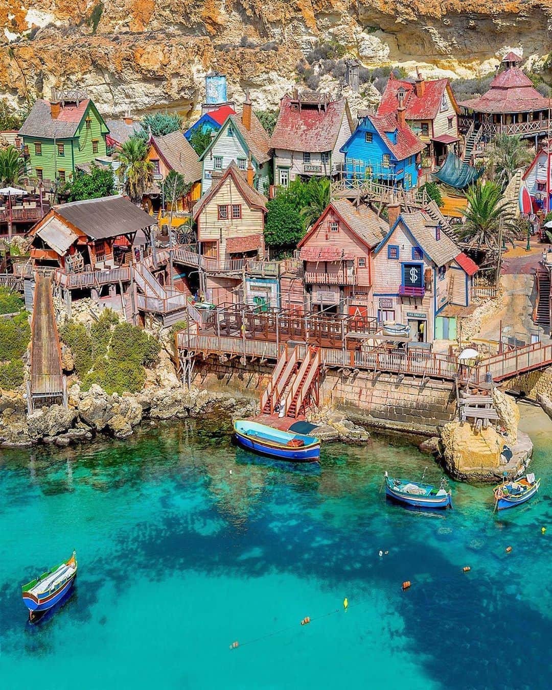 BEAUTIFUL DESTINATIONSさんのインスタグラム写真 - (BEAUTIFUL DESTINATIONSInstagram)「What a quaint village! 🇲🇹 The Popeye Village, also known as Sweethaven Village, is a purpose-built film set village for the 1980 live-action musical feature film Popeye starring Robin Williams. It's been converted into a small attraction fun park with rustic wooden buildings, boat rides, and food outlets—perfect for a fun-filled day.   What are your favorite spots that made it to the big screen? 🎞  📸 @kyrenian 📍 Popeye Village, Malta」10月7日 17時03分 - beautifuldestinations
