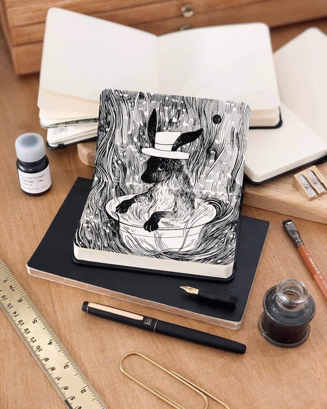のインスタグラム：「Adorable rabbit wearing hat ❤  Art by: @rena.illustration  Made With: くれ竹万年毛筆 本毛 皮調/ KURETAKE MANNEN MOUHITSU Honge Kawa-cho  #kuretake_inktober #kuretake #kuretakezig #inktober #inktober2020 #呉竹 #インクトーバー #インクトーバー2020  #kuretakeinktober #blackandwhite #blackandwhiteart #inkdrawing #inkart」