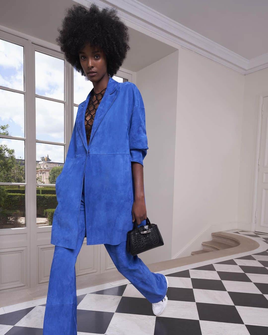 のインスタグラム：「The kind of outfit that makes you want to strut. Featuring: Leather Jacket & Trousers, Macramé Top, Freeminder Sneakers, and a Croco Calfskin Roseau Bag from the #LongchampSS21 collection.   #LongchampRoseau #LongchampRTW #Longchamp」