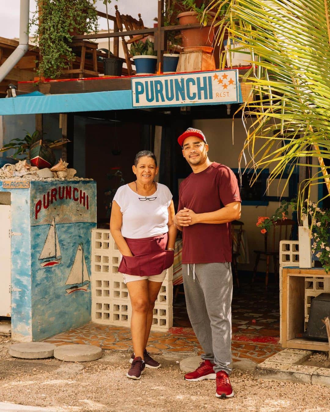 National Geographic Travelさんのインスタグラム写真 - (National Geographic TravelInstagram)「Photos by @MichaelGeorge / The restaurant Purunchi is part of a small fisherman’s village on the south side of the island of Curaçao. The setup is pretty ingenious. They built a row of buildings on the ocean, with a seawall to protect them from the waves. There are restaurants on the first level, and the fishermen and families who run the restaurants live on the second floor. Their boats are anchored just behind the floating seating areas, and they sometimes fish only five feet (1.5 meters) from where you’re eating. There are no menus; they simply drop off the catch and tell you what’s available. It is ocean-to-table dining and some of the freshest seafood you’ll ever have.  In a few of these images, you can see the invasive lionfish, which is territorial and has been decimating local fish species. Fishermen catch the lionfish en masse and fry it up at these restaurants. One lucky thing: It is delicious, so it’s an easy sell. For more photos and writing from my travels, follow along @MichaelGeorge. #curacao #purunchi #lionfish #fishermen #fishingvillage」10月8日 1時08分 - natgeotravel
