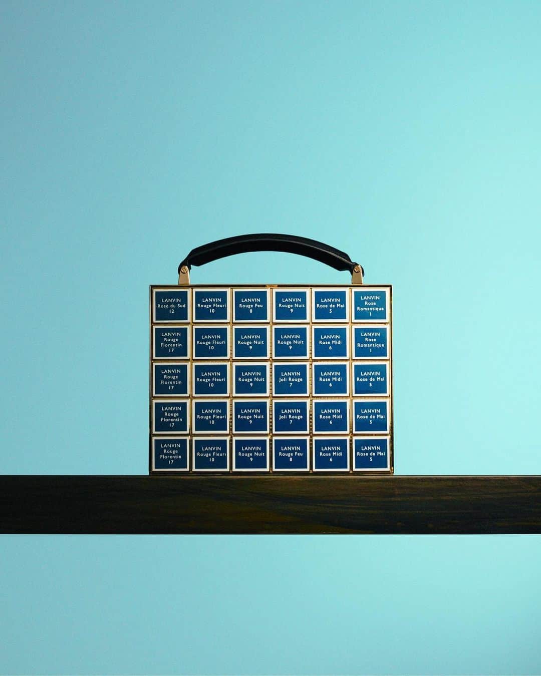 ランバンのインスタグラム：「The “lipstick“ minaudière bag echoes to the vintage #LANVIN beauty drawer storing a palette of lipsticks refills from the 1930s, and their colorful titles, such as “Rouge fleuri“ or “Rose romantique“.  The “Cosmetics” capsule collection is inspired by LANVIN beauty archives. Available now in Lanvin stores. #LanvinBags  #LanvinFW20」