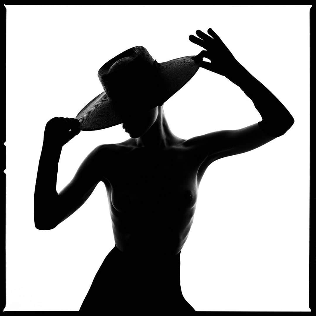 タイラー・シールズのインスタグラム：「If hard work is done correctly the viewer see’s only effortlessness.  I am excited to debut the first image from my new series called Silhouettes. This is “Hat Silhouette”, if you swipe right you can see it printed 60 by 60 inches this image and the rest of this series are a new step for me. This is one of the funnest series I have ever made, and it’s not without its challenges, I worked for months testing the exact camera, film, and light combination to create a texture in image that I had never seen before, using a @hasselblad and @ilfordphoto I found a tone I had dreamed of for months of quarantine.   I have spent the majority of my photography carrer avoiding harsh shadows in an image, but this series changed all that it was no longer about avoiding the darkness but creating it, telling a story from a graphical view, allowing only shadows and lines to create the narrative, a new step for me, but one I have fallen in love with.  This series has made me think differently and see in a new way, for that I am forever grateful. Now as the first prints start to make their way to collectors homes, I am seeing them Framed and on the walls which is where I always intended them to be.   Let me know below in the comments where you would hang this print, and If you are excited to see more from this series?」