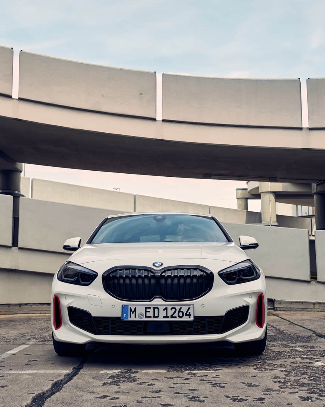 BMWのインスタグラム：「A strong character that makes your head turn. And heart jump. The return of the 'Turismo Internazionale': the new BMW 128ti. #THE1 #BMW #1Series #sports @thejasonpaul __ BMW 128ti: Fuel consumption in l/100 km (combined): 6.4–6.1. CO2 emissions in g/km (combined): 148–139. Further information: www.bmw.com/disclaimer.  	 Acceleration (0-100 km/h): 6.1 s. Power: 195 kW, 265 hp, 400 Nm. Top speed (limited): 250 km/h.」