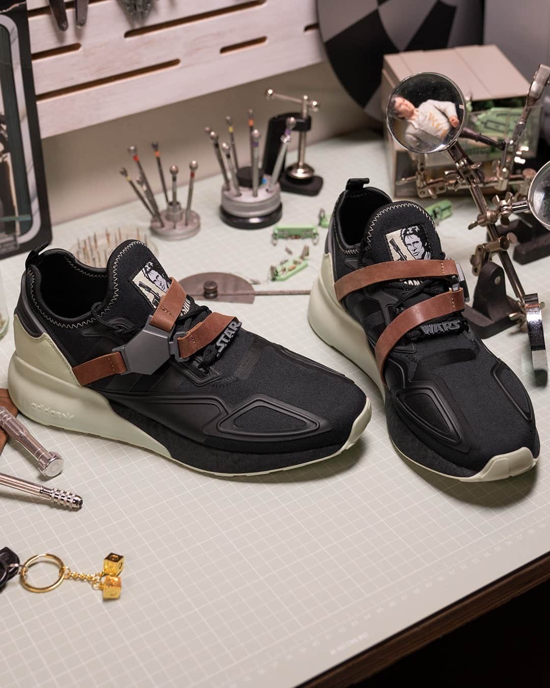 のインスタグラム：「We honor the captain of the Millennium Falcon, Han Solo with a fresh take on the ZX 2K BOOST. Evoking the intrepid explorer’s outfit in Star Wars: The Empire Strikes Back, the sneaker mimics his battle-ready equipment and boasts a belt strap and large buckle, which can be turned over to reveal hidden messages. Landing at adidas stores and adidas.com from tomorrow.  See more at adidas.com/Star_Wars  #adidasStarWars」
