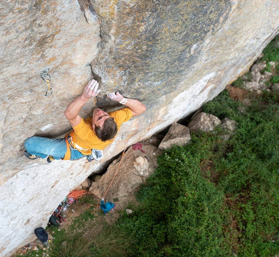 ヨルグ・バーホーベンのインスタグラム：「"Holiday at the beach", they said, and some "relax time on Sardinia".  Me fighting tiny crimps on slabby 8c routes: 🙈👻😱😎 • 📸@tobias_lanzanasto  #ulassai #notcomplaining #bestrock @lasportivagram @marmot_mountain_europe @vibram @petzl_official」