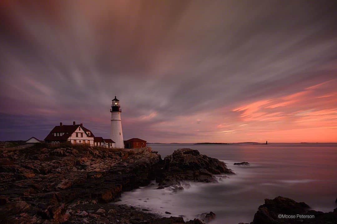 NikonUSAさんのインスタグラム写真 - (NikonUSAInstagram)「From #NikonAmbassador moosepeterson: “‘How can anyone spend two weeks photographing just lighthouses?’ I love some questions that come my way, they are so spot on. And if I were working with bald skies the entire time, then my response would be totally different from, ‘It was easy!’ With no two skies nor light the same, each day was so different it was always new though the subject was, a lighthouse. I ended up going to the Portland Head Light four times and of those times, this was my favorite shot. The #nikonZ7 / #nikkorZ24-200 was opened for 13 minutes for this shot as the sun was thinking of peaking over the horizon. I timed the opening of the shutter so it would close a minute before the sun would actually light the lighthouse. While the tide was out, the clouds make up for lack of movement in the foreground. Good times, good time.”  Follow @moosepeterson to see more! #lighthouse #landscapephotography #lighthousesofinstagram」10月10日 3時23分 - nikonusa