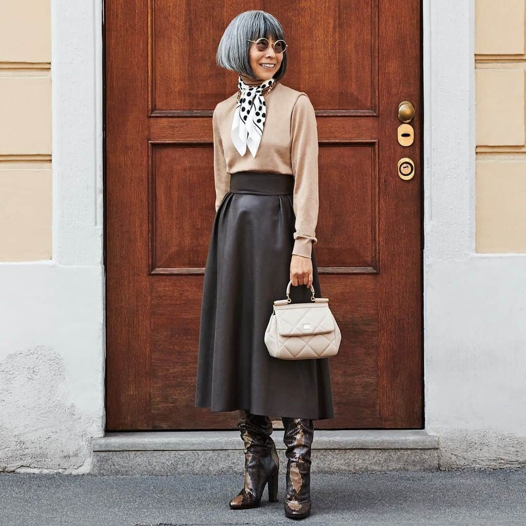 ドルチェ&ガッバーナさんのインスタグラム写真 - (ドルチェ&ガッバーナInstagram)「#DGRealPeople, the campaign celebrating individuality on the streets of Milan.    Through photography, Yoshie focuses on self-expression for the pursuit of beauty and the meaning of life.  She wears a beige turtleneck sweater, a brown longuette skirt, tall high heel boots, a beige matelassé #DGSicilyBag and a polka dot foulard.    Shop the #DGFW20 look at the link in bio.    #DolceGabbana」10月10日 4時00分 - dolcegabbana