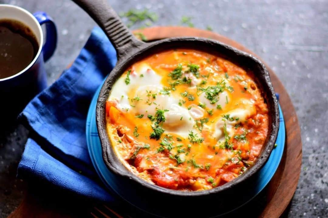 Archana's Kitchenさんのインスタグラム写真 - (Archana's KitchenInstagram)「Spicy Moroccan Eggs Recipe is a great exotic breakfast recipe to try on a lazy weekend morning. Poached eggs in a sauce based on tomatoes, bell peppers spices and onions are divine to taste. This recipe preparation is similar to Shakshouka/Shakshuka which is also a skillet dish. Serve Spicy Moroccan Eggs Recipe for with a crusty bread like Roti Gambang or Focaccia. Get the recipe from the smart.bio link in my profile @archanaskitchen . . . . . . #recipes #easyrecipes #breakfast #Indianbreakfast #archanaskitchen #healthyeating #highprotein #breakfastclub #dosa #dosarecipes #dosabatter #ragi #ragidosa #mysoremasaladosa #homemadefood #eatfit #cooking #food #healthyrecipes #foodphotography #recipeoftheday #comfortfood #deliciousfood #delicious #instayum #food」10月10日 11時30分 - archanaskitchen